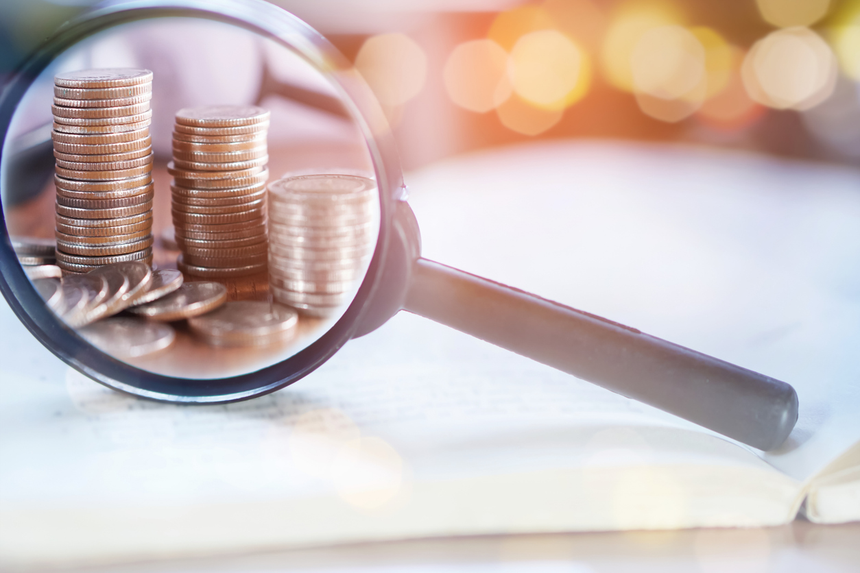 Image of magnifying glass and coins